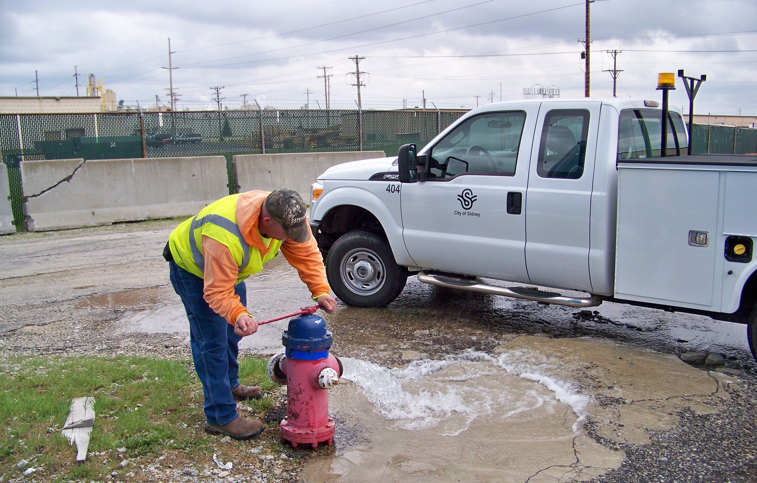 City of Sidney employee testing fire hydrant