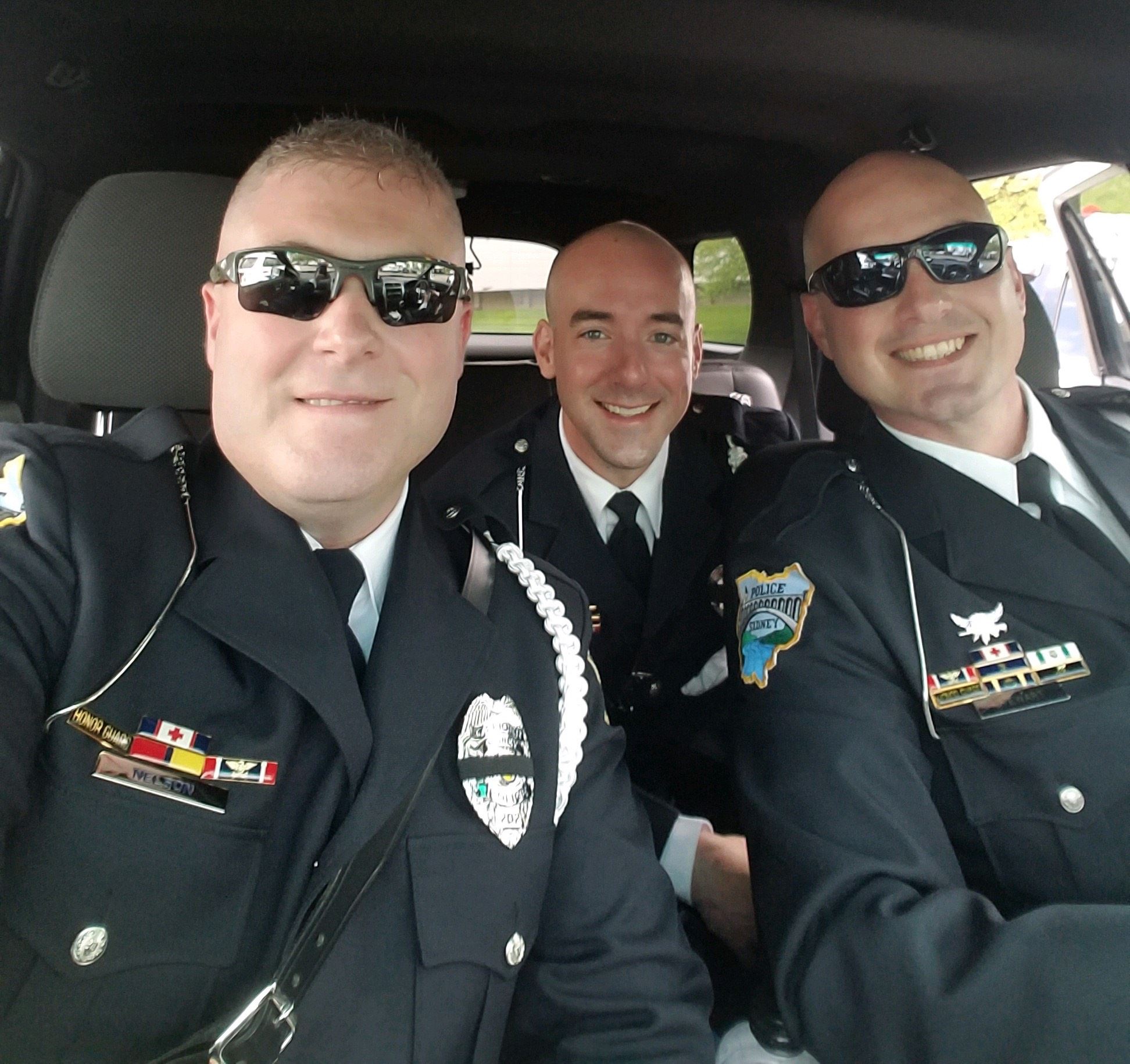 Three members of Honor Guard pose for a picture