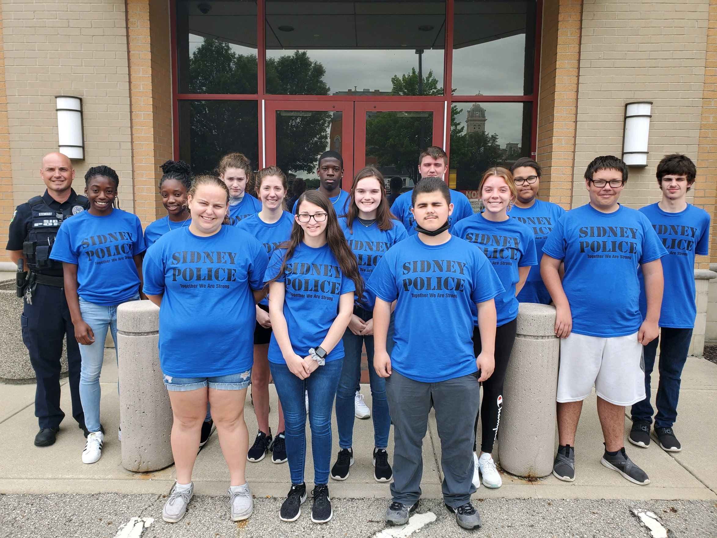 Members of the teen academy pictured in front of P.D. 