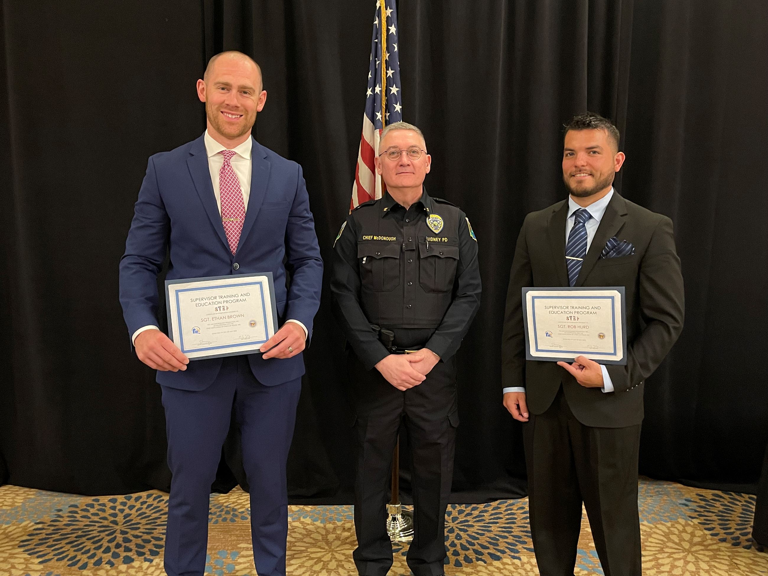 Sgt. Brown, Chief McDonough and Sgt. Hurd pose for a photo at the STEP program graduation ceremony