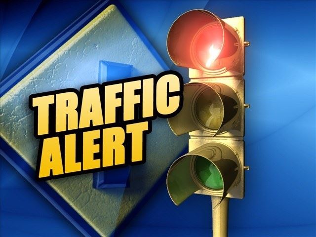 Stop light with the words Traffic Alert